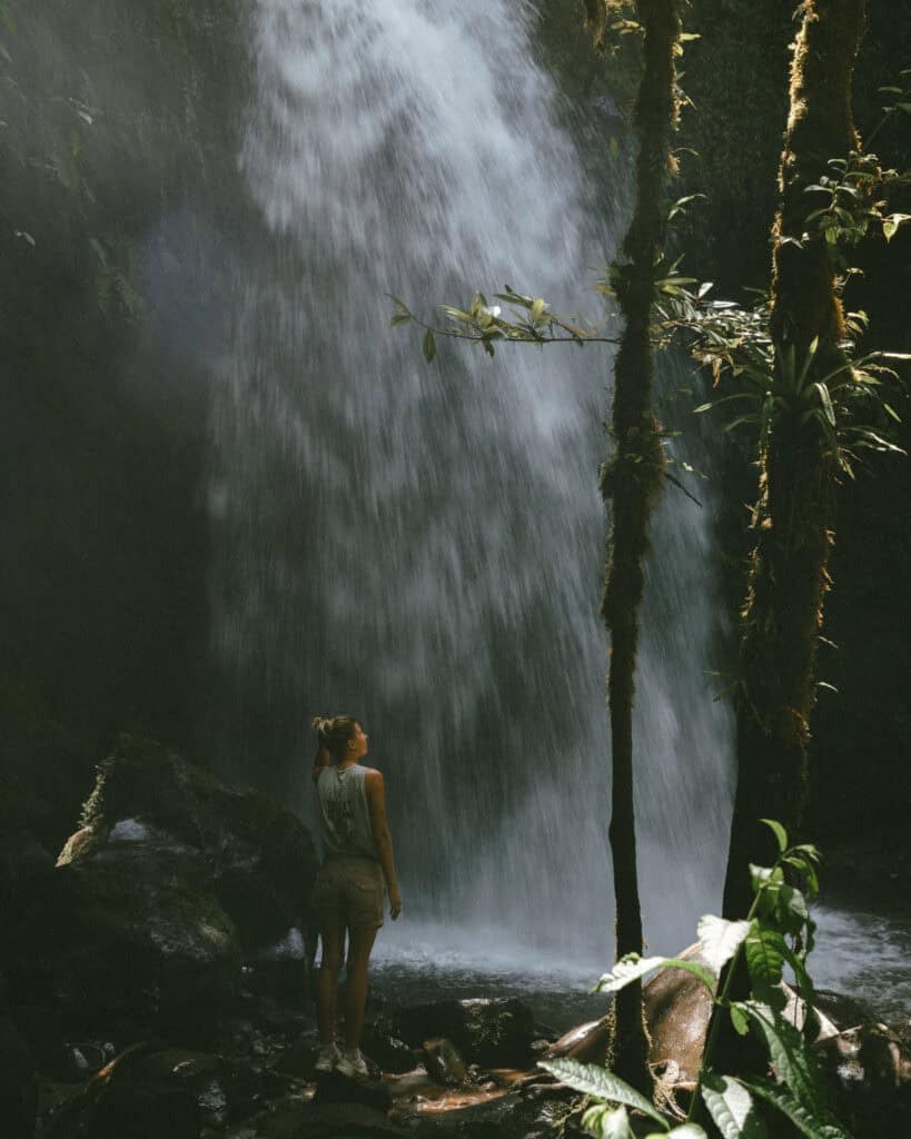 Third waterfall on The Lost Waterfalls trail with powerful cascading water and serene misty atmosphere