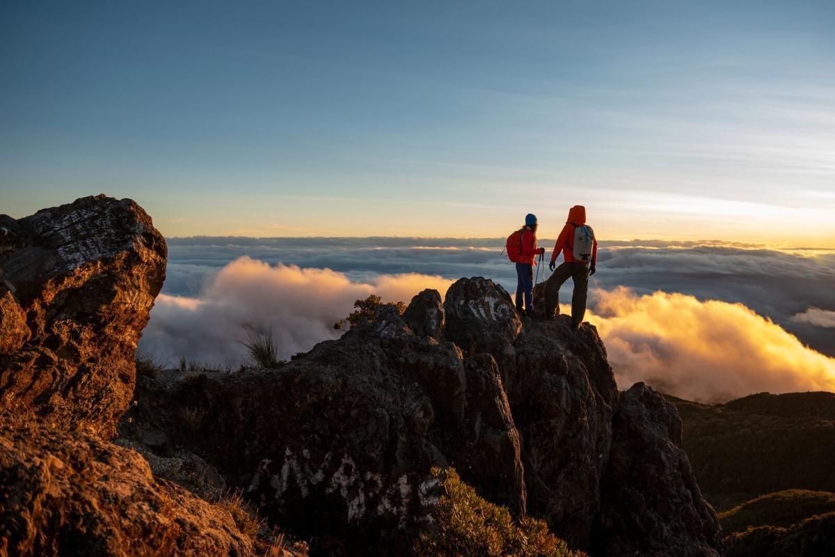 Sunrise above a sea of clouds from the rocky summit of Volcan Baru Panama