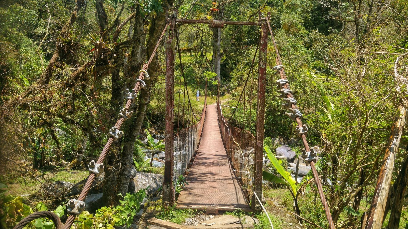 Spectacular suspension bridge crossing a rushing river valley in Boquete Panama